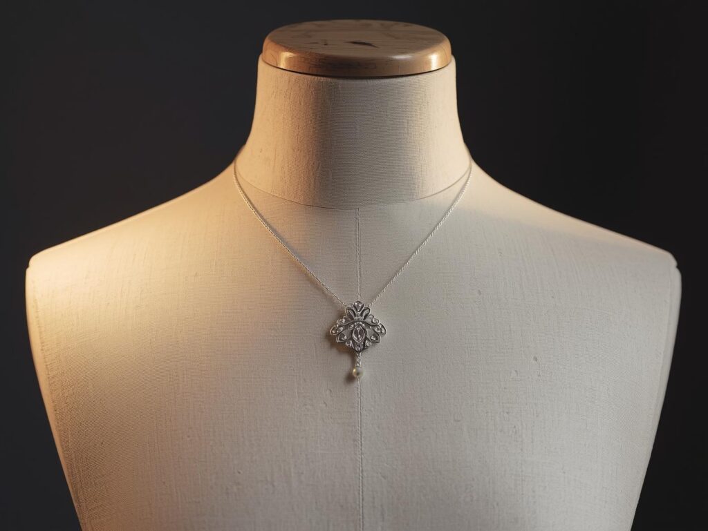 palladium pendant necklace displayed on a mannequin bust